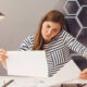 A woman on a phone, with papers, looking busy ready to hear some self care tips for women