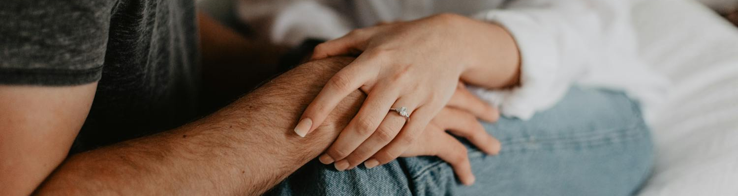 People holding hands in support