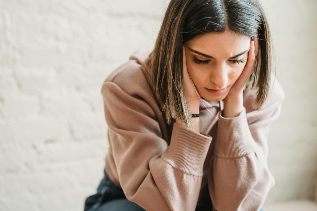 A sad person sitting alone